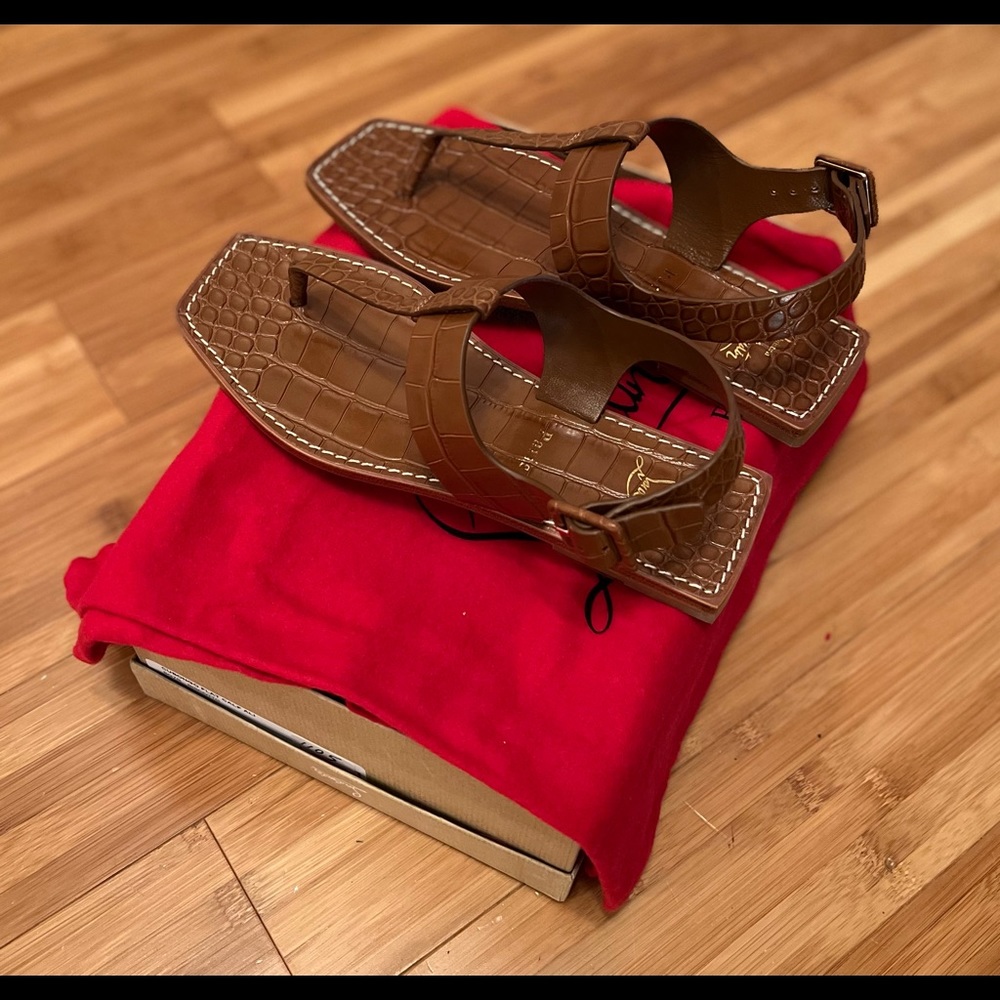 Brand New (Never Been Worn) Brown Christian Louboutin sandal.